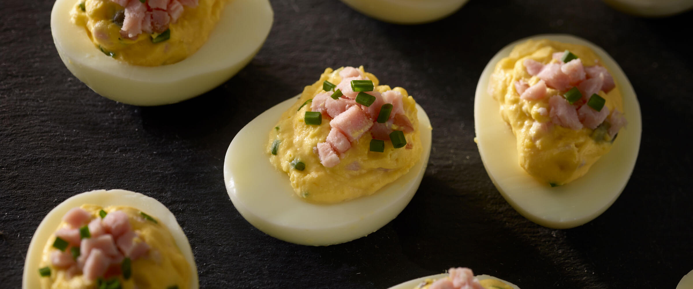 Deviled Eggs with Canadian Bacon topped with chives