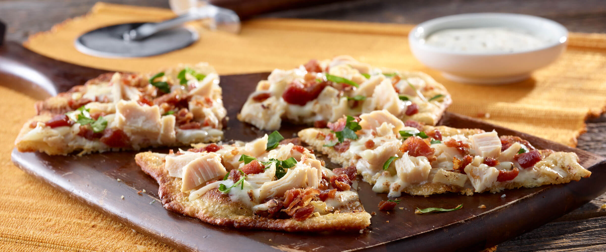 Chicken Bacon Ranch Flatbread Pizza on wood board