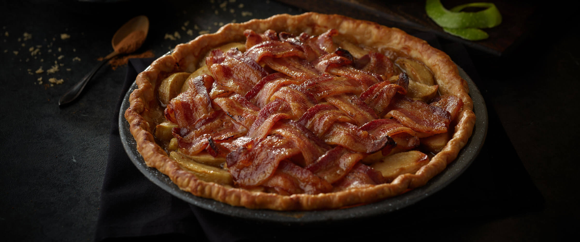 Apple Cider Bacon Lattice Pie in pie pan