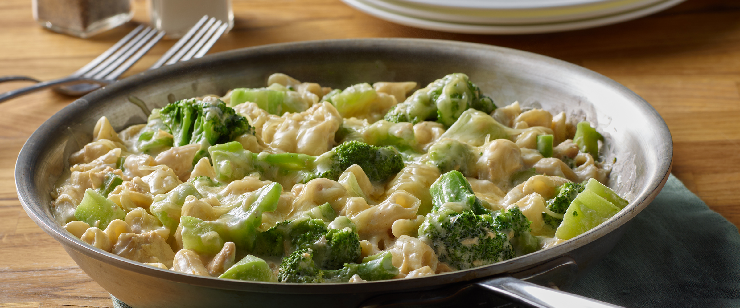 Chicken Alfredo Broccoli in a skillet on a kitchen table