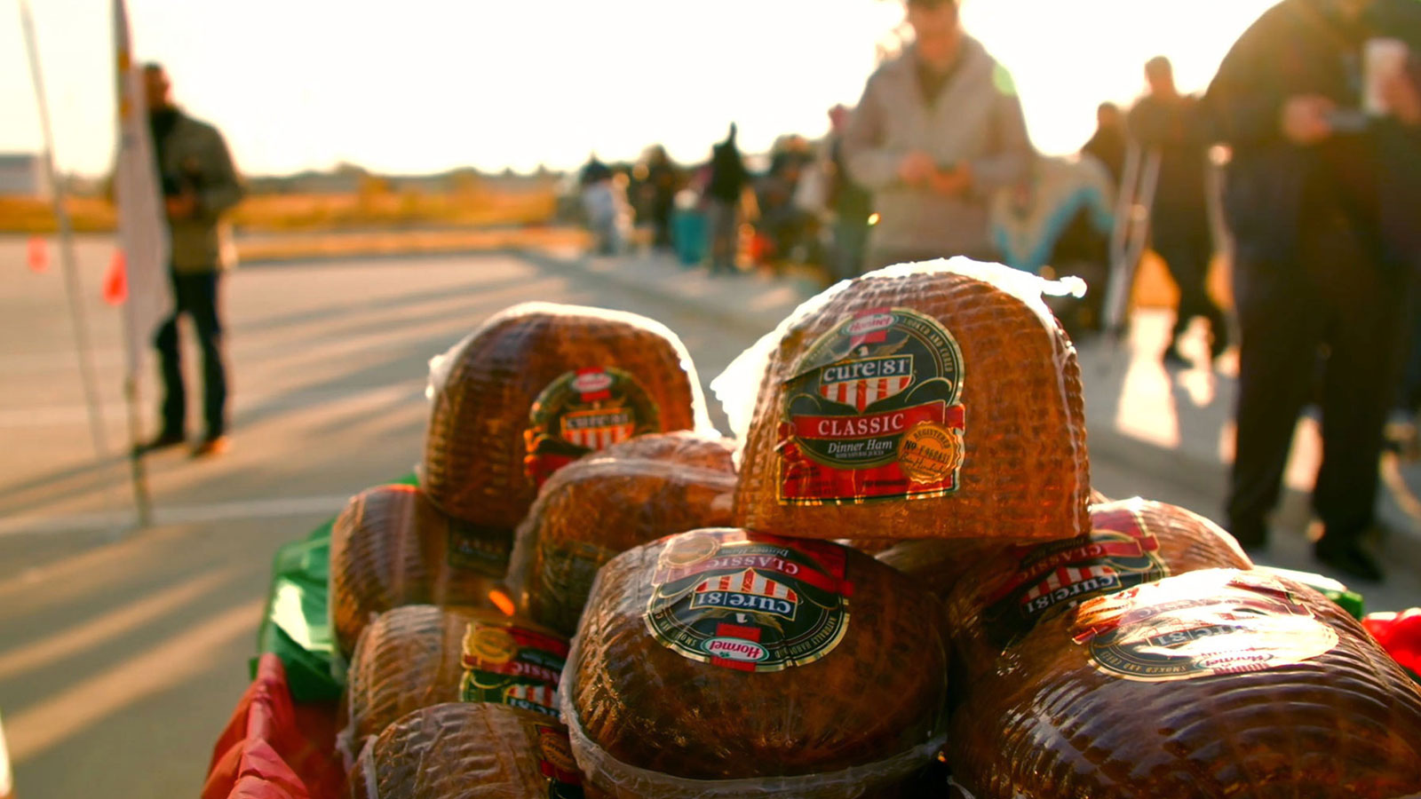 Hams for Hunger table piled with package of ham