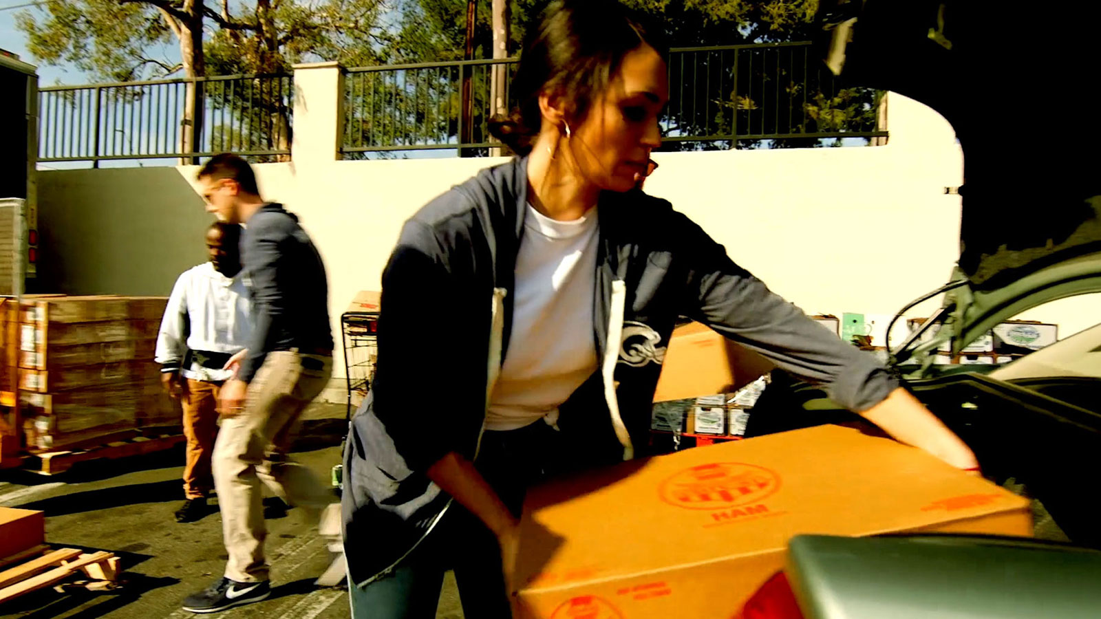 Hams for Hunger participants moving boxes of ham