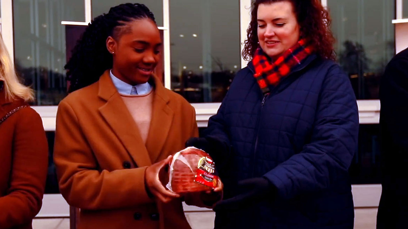 Hams for Hunger participants holding ham