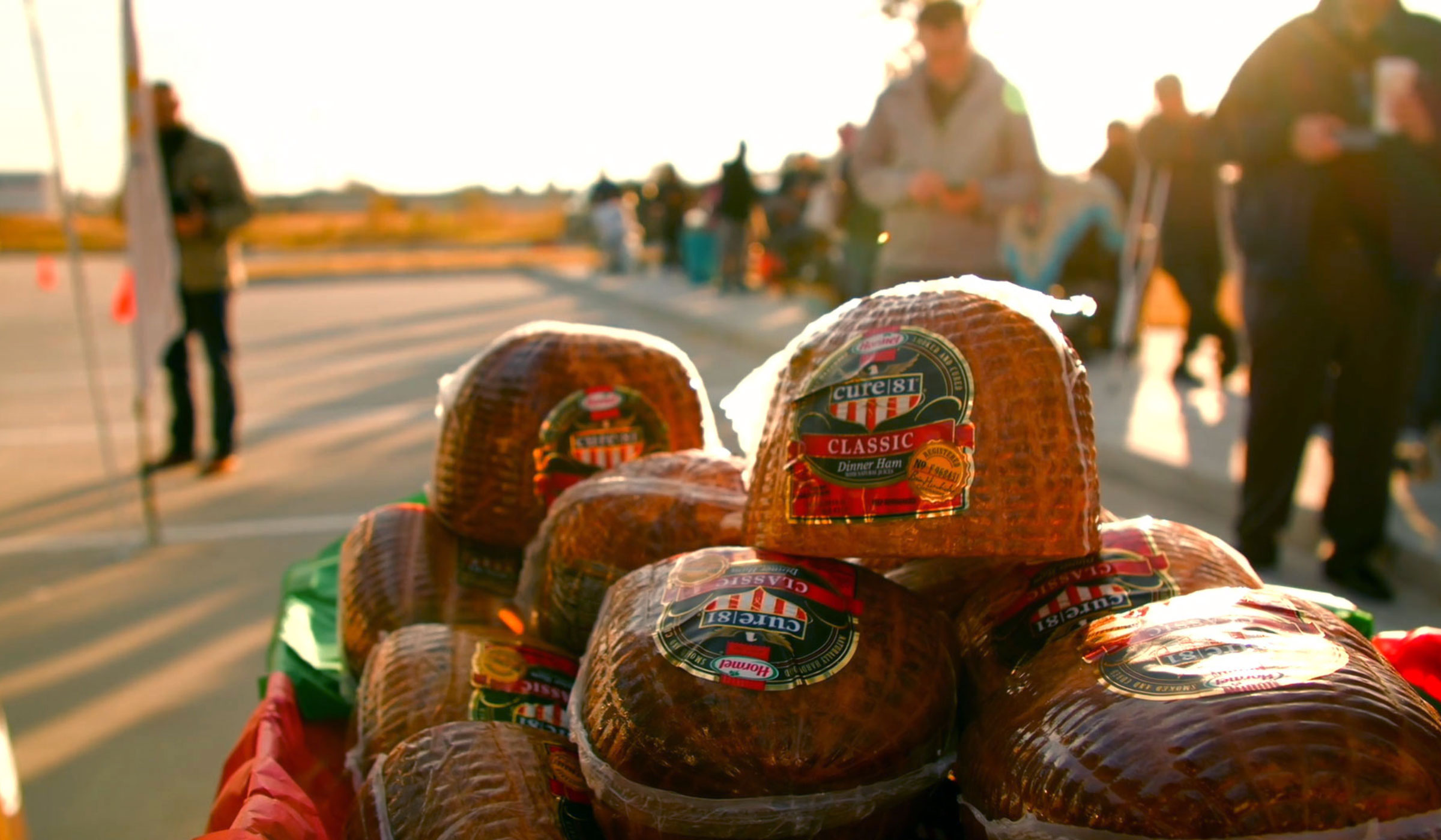 Hams for Hunger table piled with package of ham