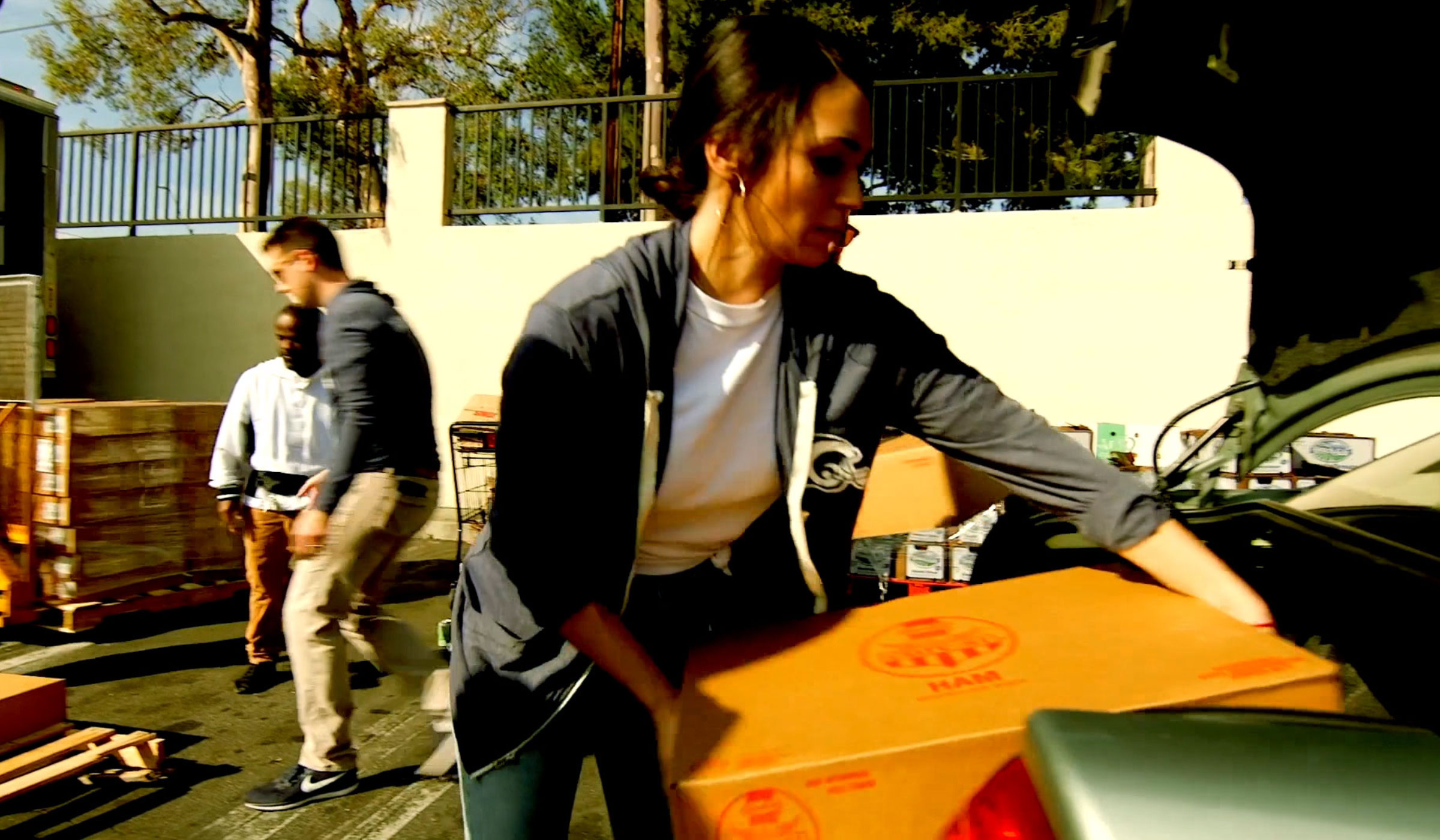 Hams for Hunger participants moving boxes of ham