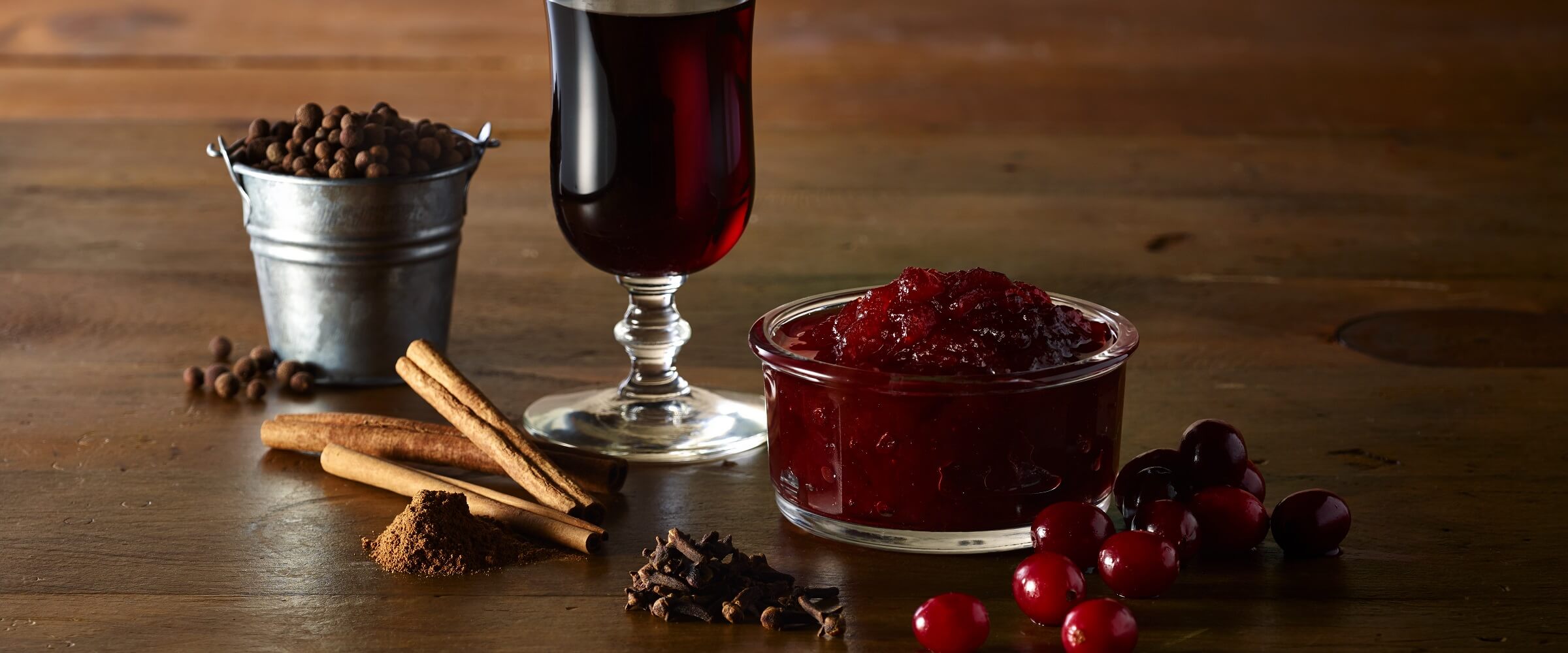 cranberry port glaze in clear bowl with glaze ingredients displayed