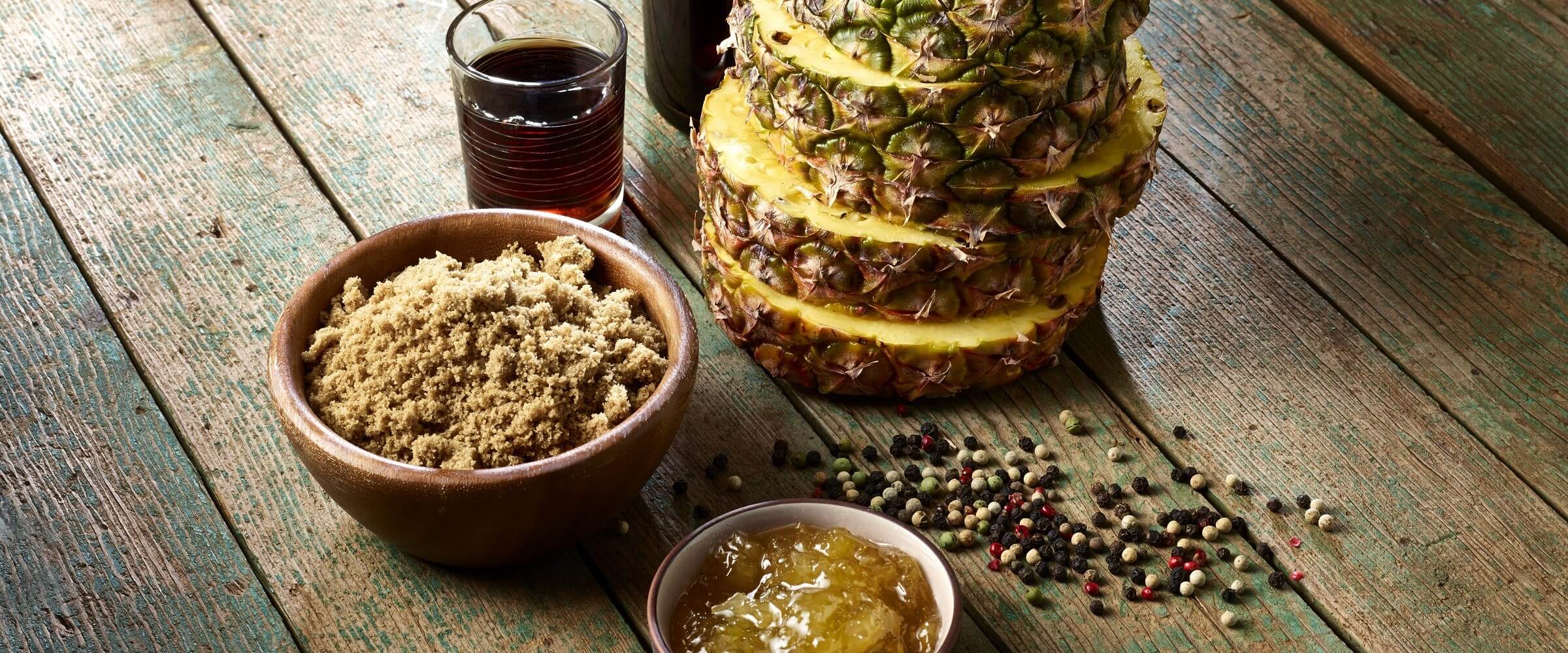 pineapple rum glaze in bowl with its ingredients displayed