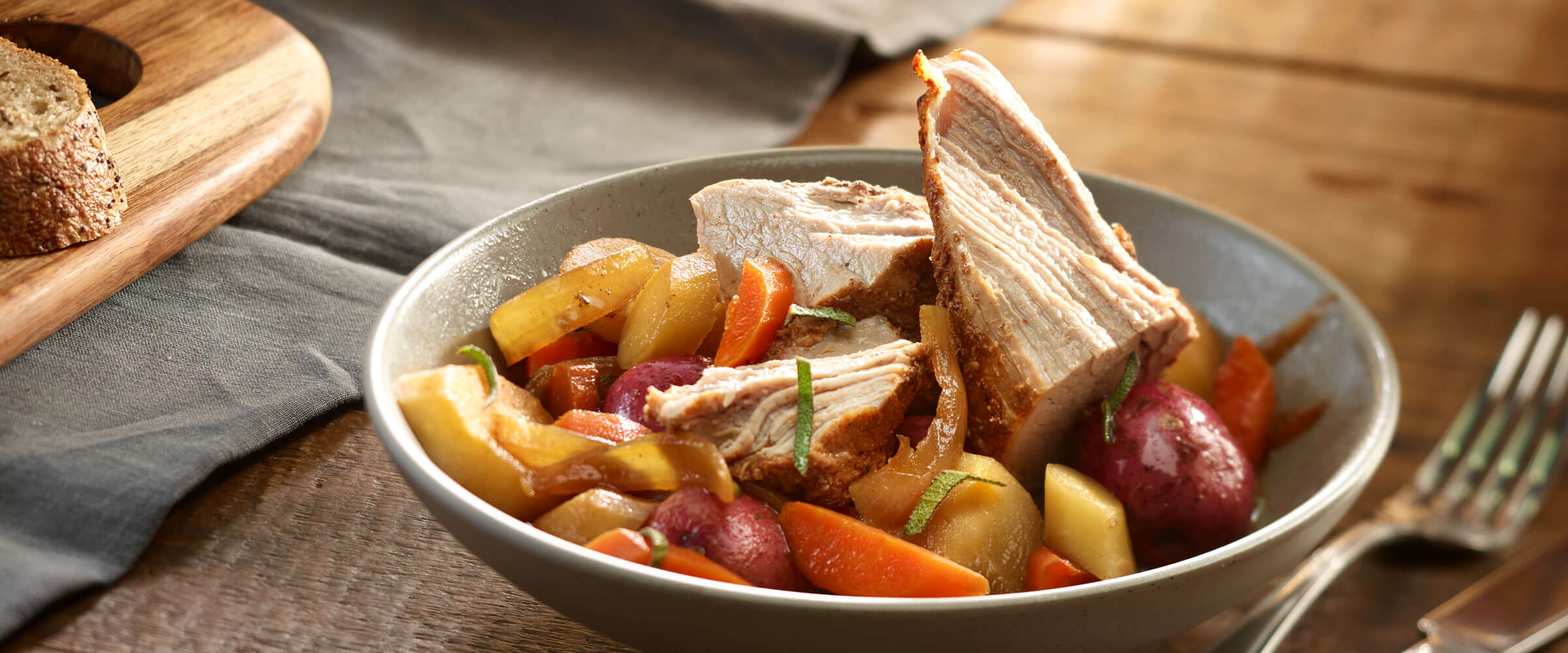 Slow-Cooked Pork & Veggies in gray Bowl with fork