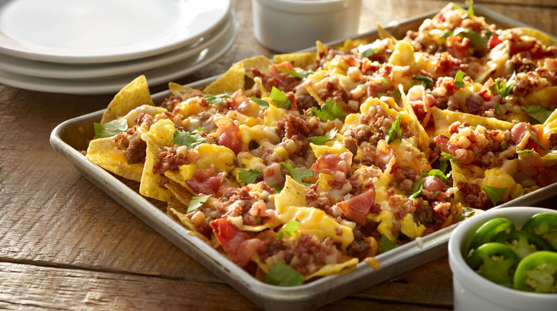 Corn beef hash nacho bake on sheet pan with jalapenos