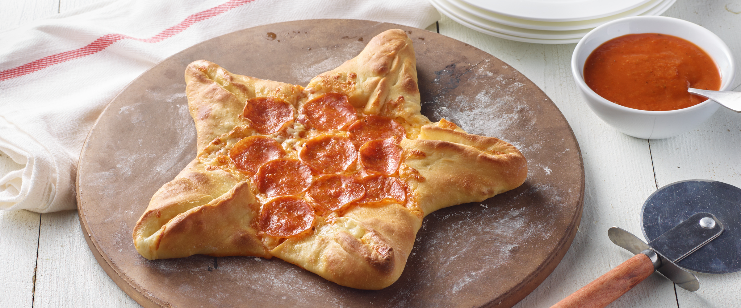 Transform your movie night with this whimsical Star-Shaped Pepperoni Pizza! Crafted pizza dough folded into the shape of a star, filled with gooey mozzarella cheese, pizza sauce and zesty HORMEL® Pepperoni, perfectly arranged to create a visual and taste sensation. Gather the family, dim the lights, and embark on a movie night adventure with our Star-Shaped Pepperoni Pizza