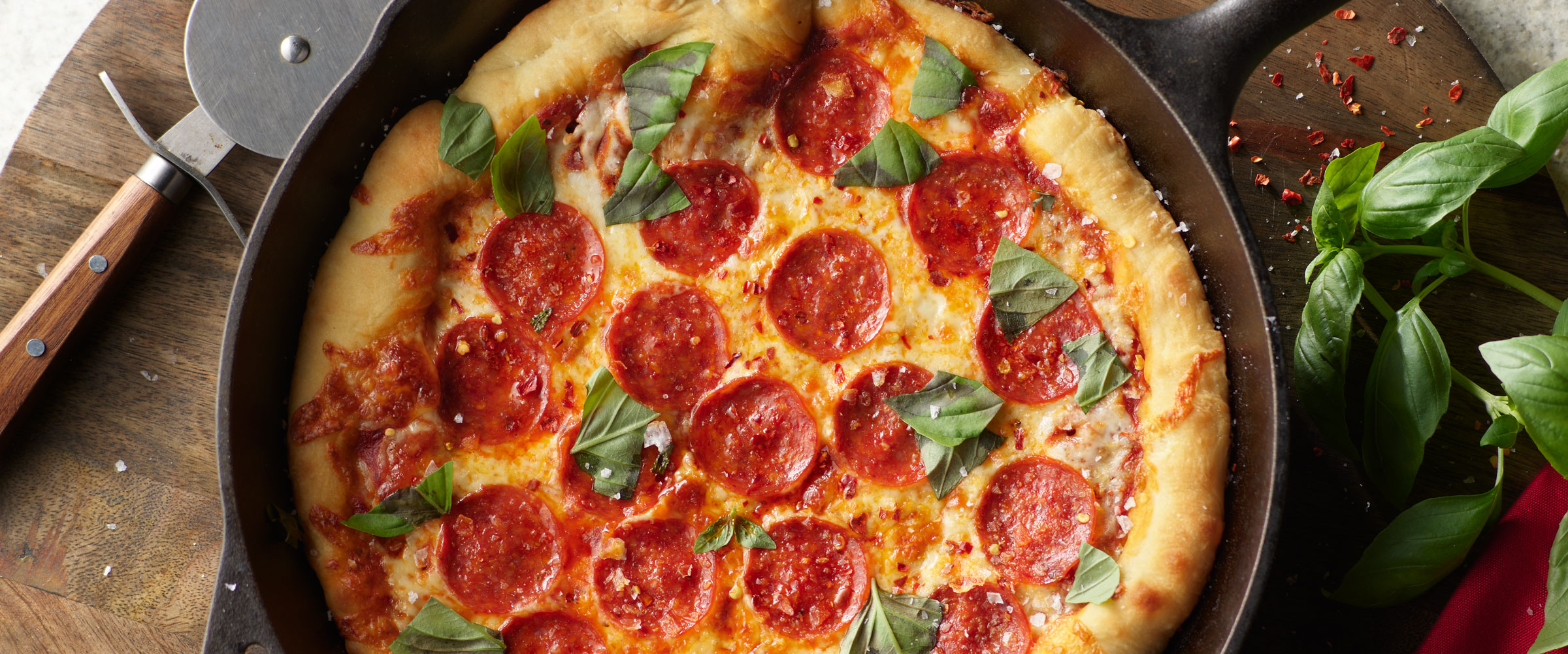 Pepperoni Cast-Iron Pizza topped with basil