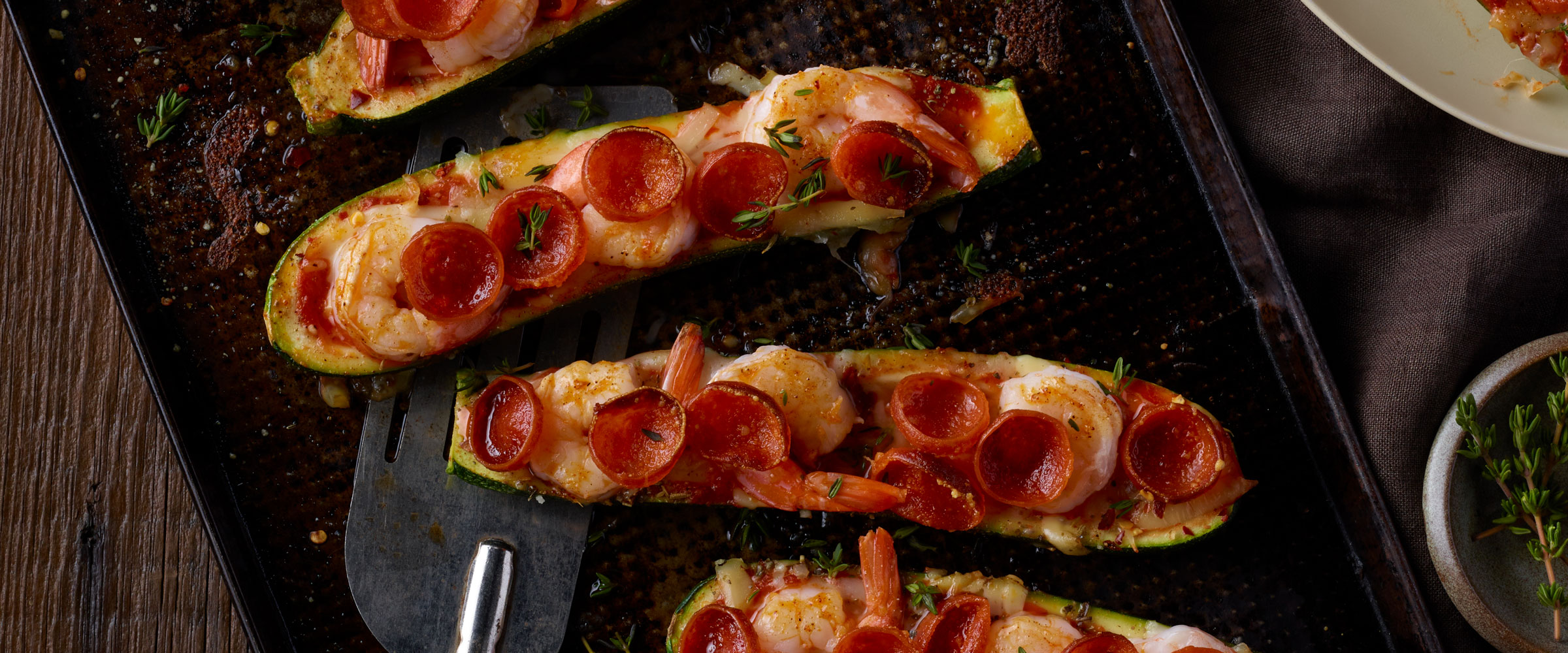 Cup N’ Crisp and Shrimp Zucchini Pizza Boats on sheet pan