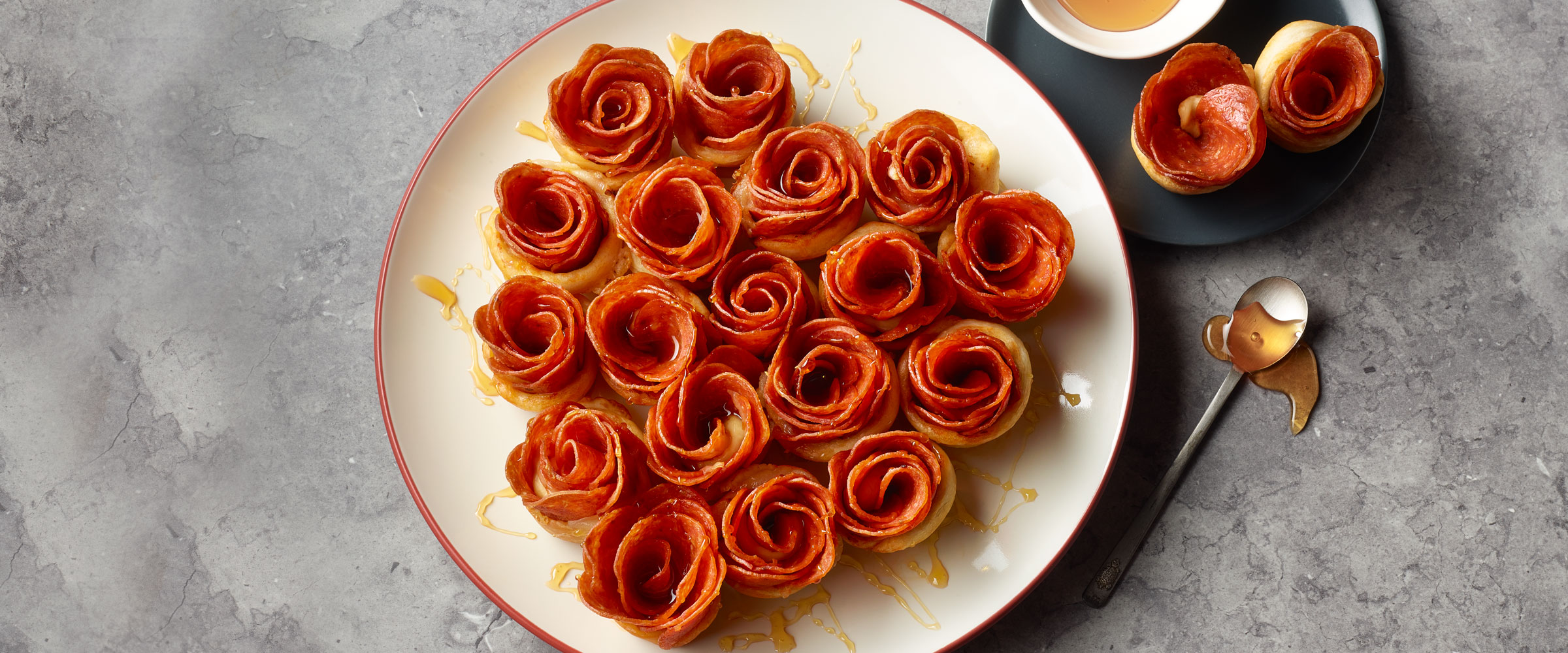 Pepperoni Roses drizzled with hot Honey