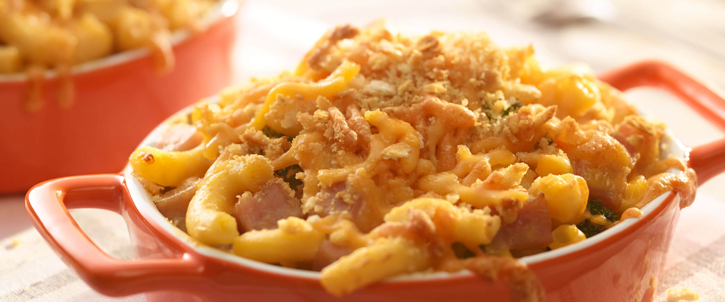 Ham and Broccoli Mac and Cheese bake in red dish
