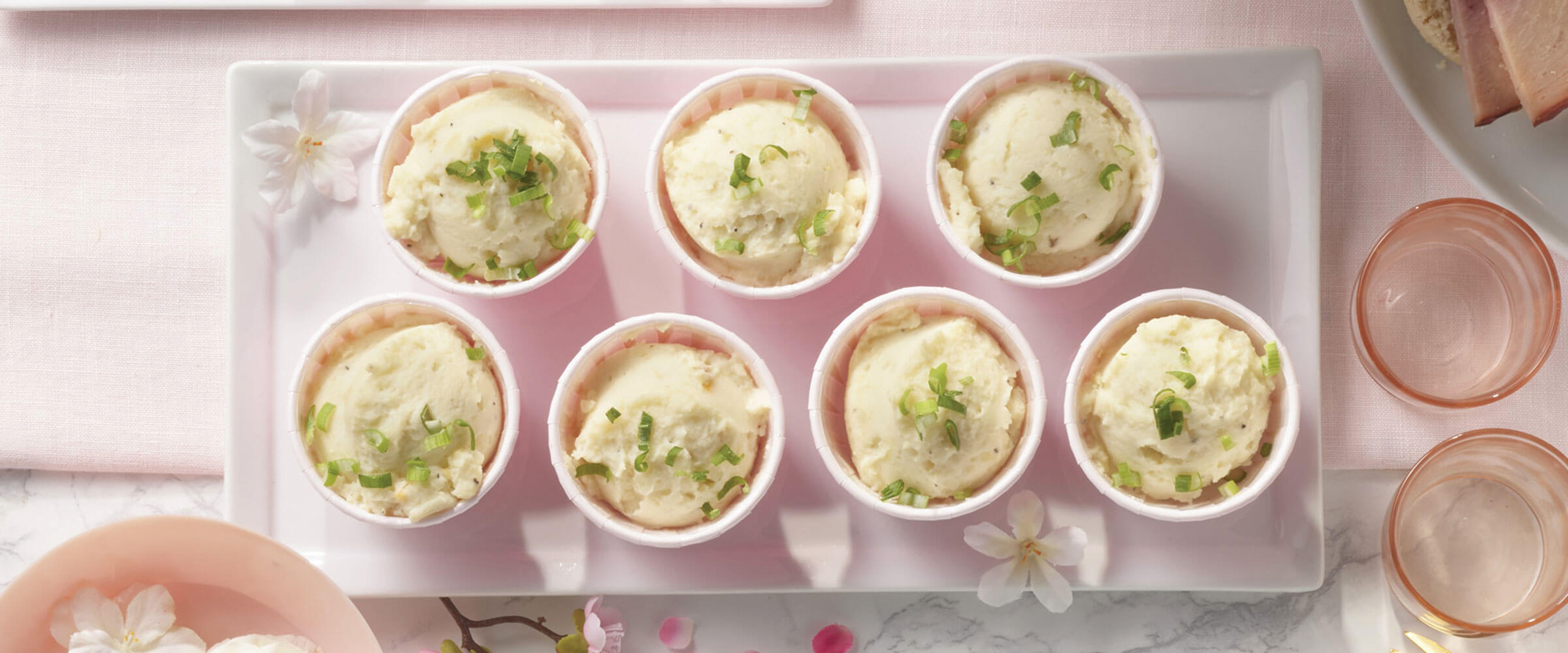 Mashed Potato Puffs in individual bowls on white plate