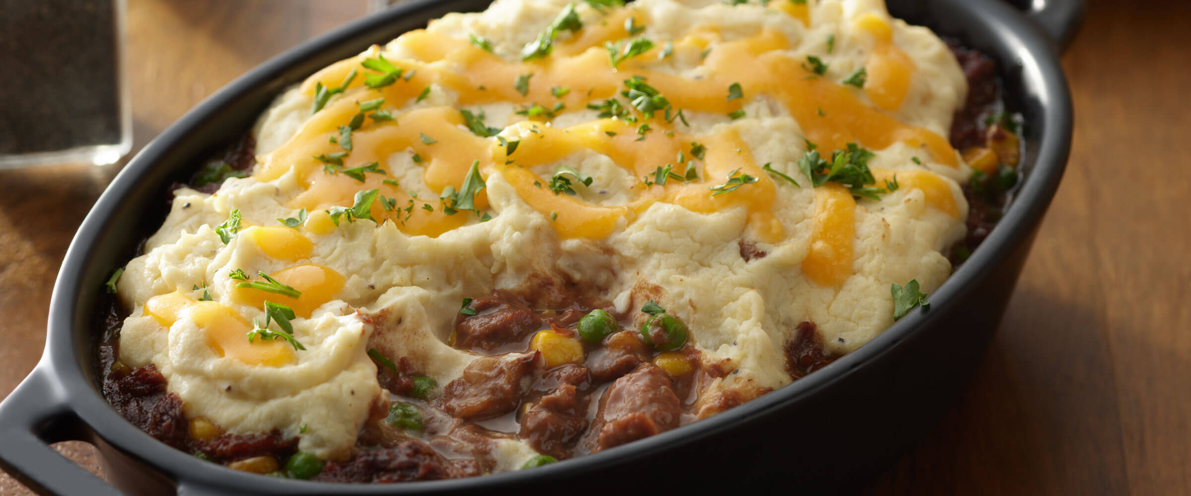 Shepherd’s Pie in cast iron skillet topped with cheese