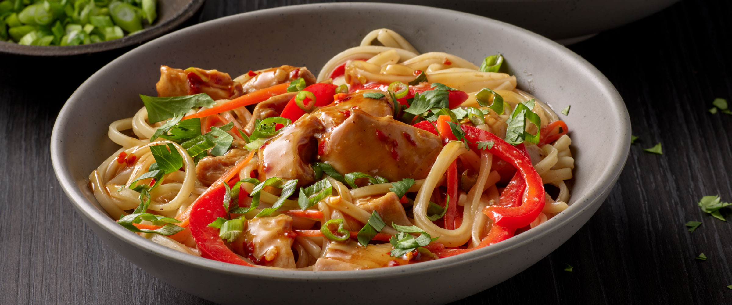 Spicy Ginger Chicken Over Pad Thai Noodles