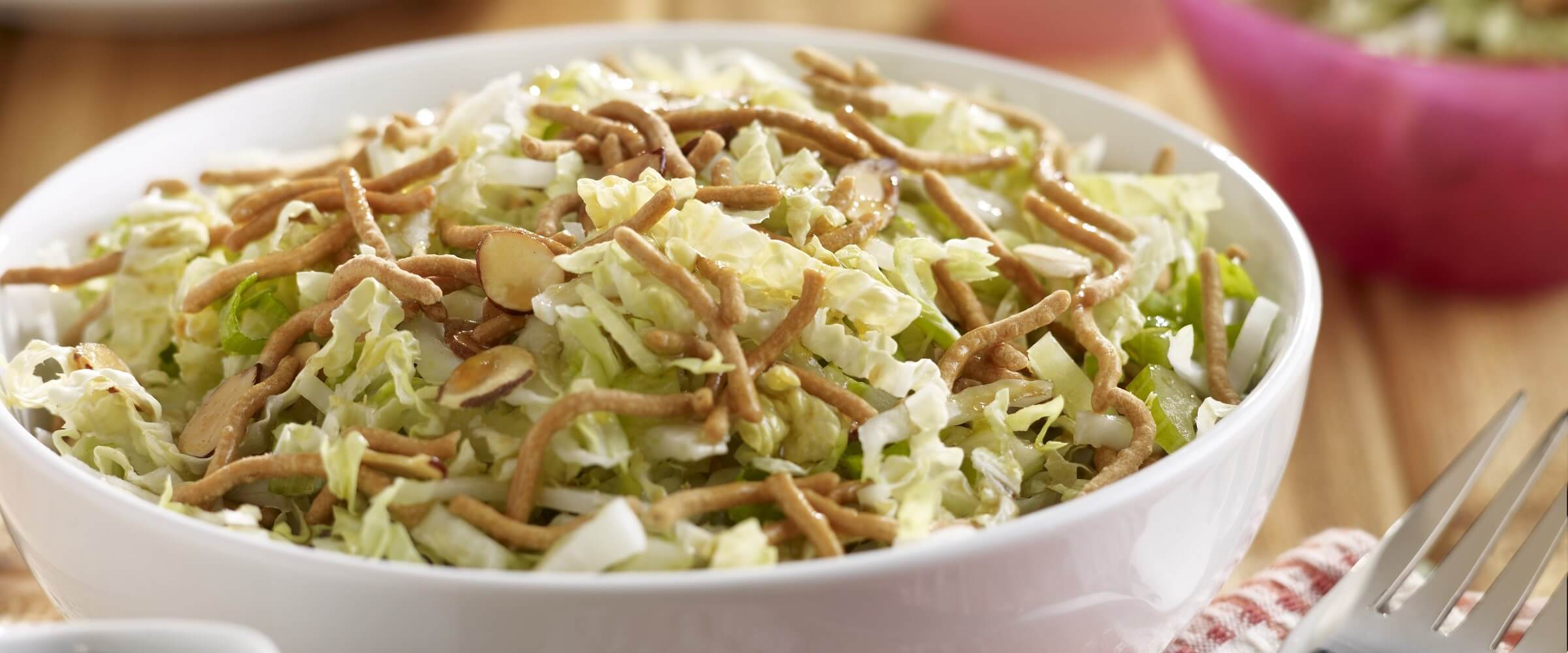 crunchy cabbage salad in white bowl