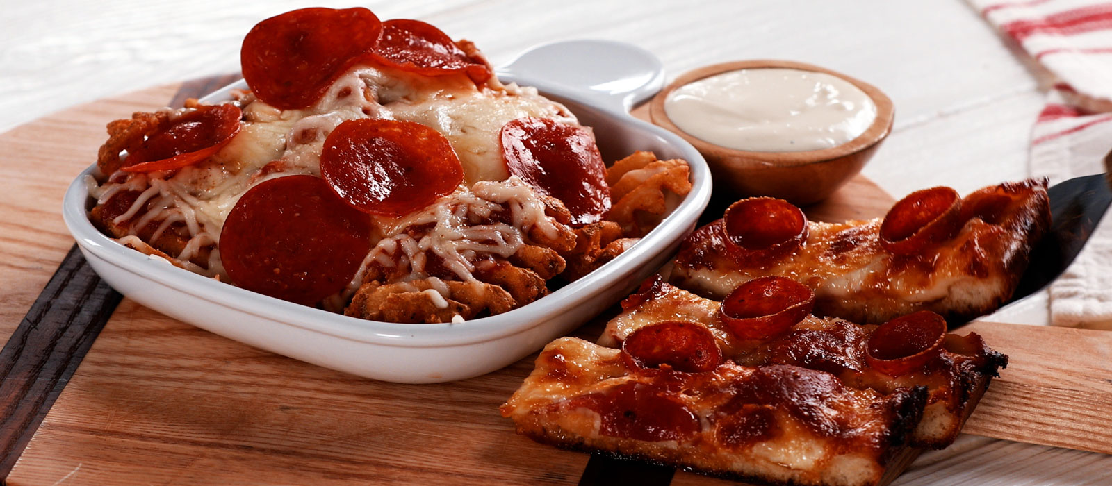 Wood pizza Board topped with pizza fries and sticks