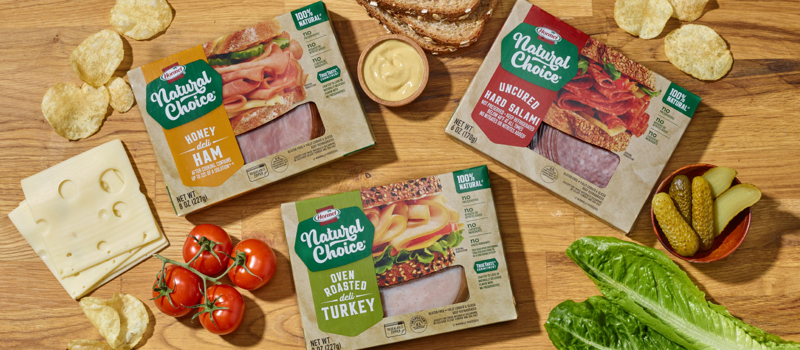 New Natural Choice meats packaging surrounded by sandwich ingredients