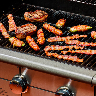 Bacon cooking on grill